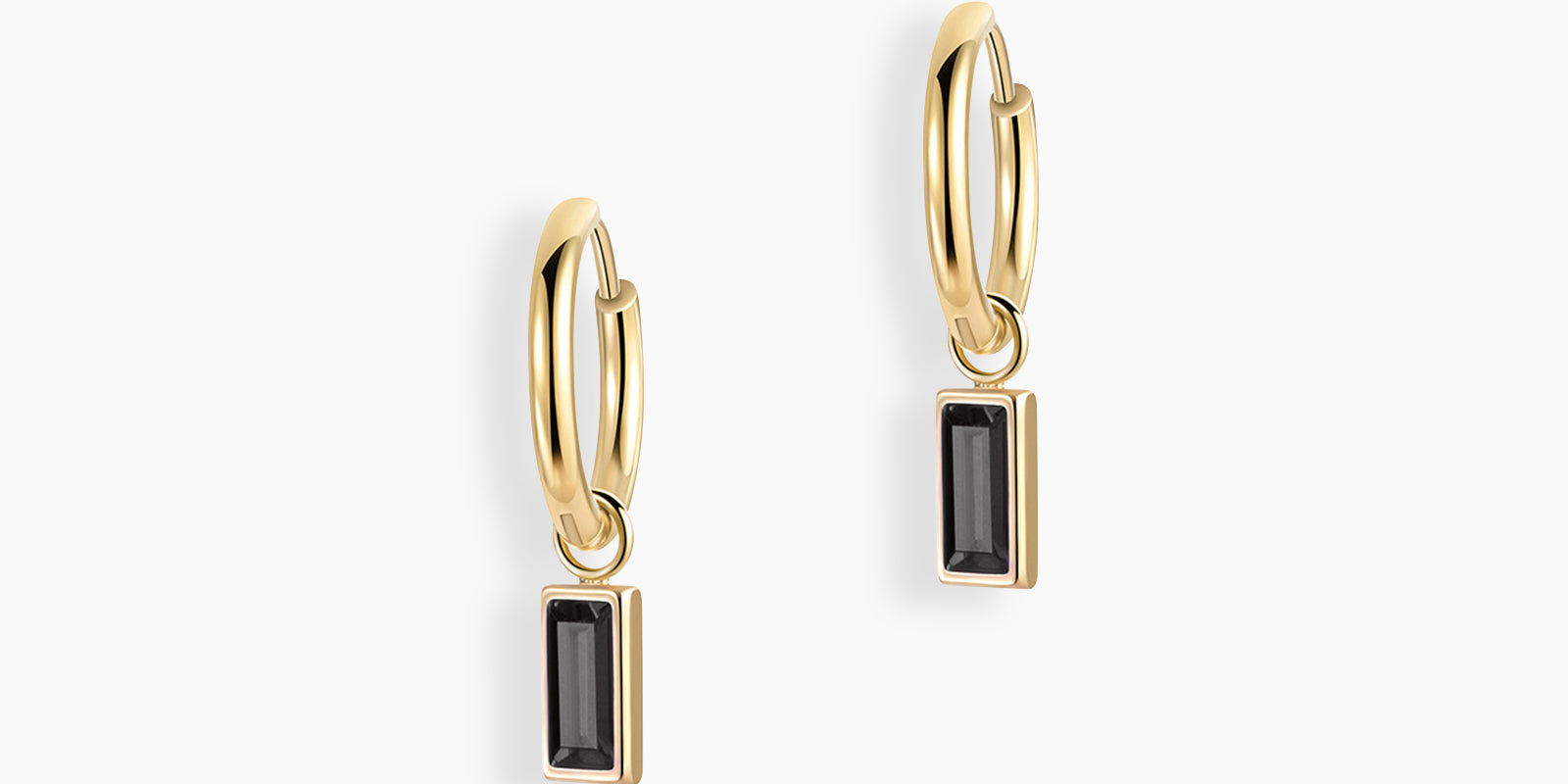 Black drop earrings with a slender hoop adorned with a single baguette-cut zircon stone