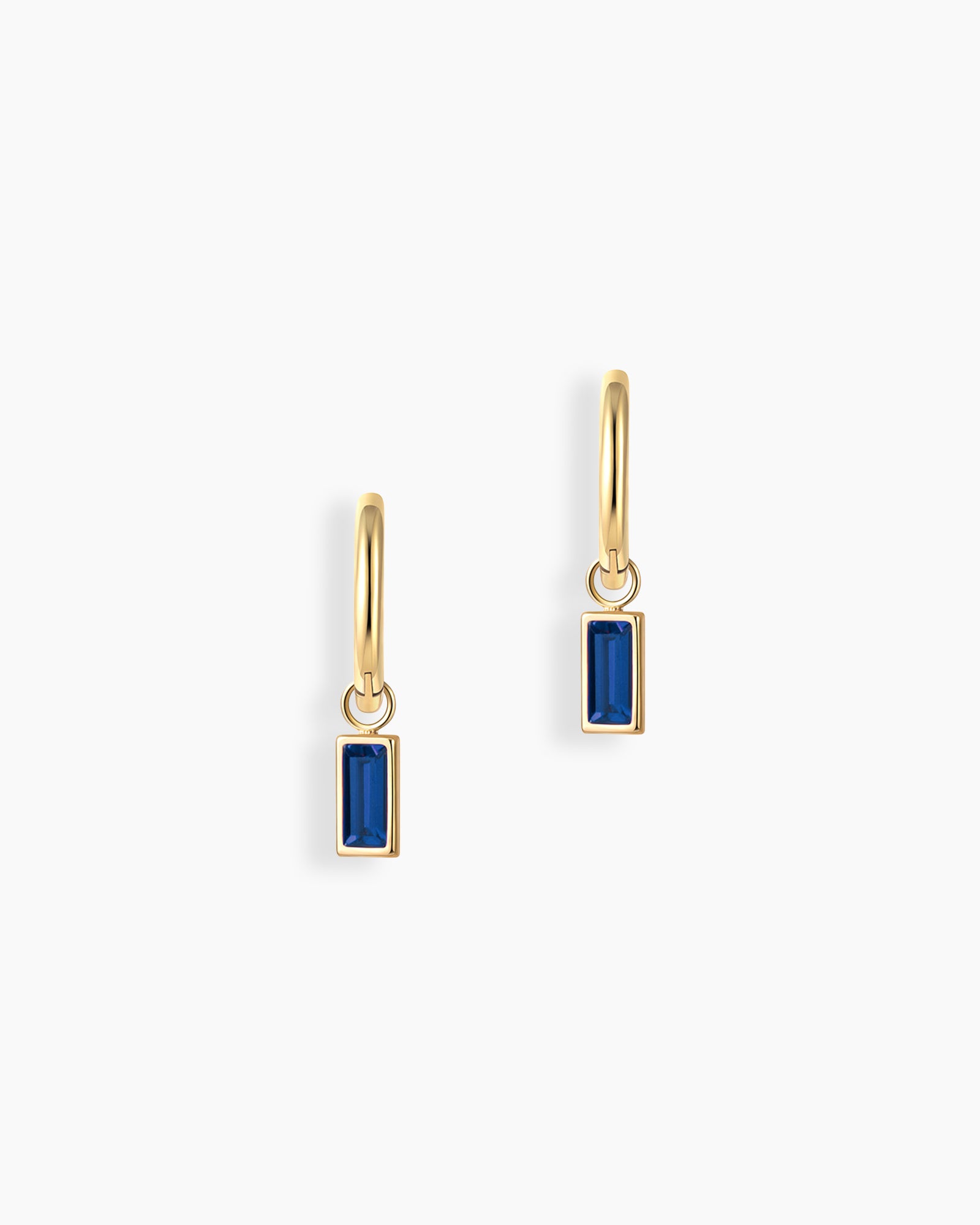 Blue drop earrings with a slender hoop adorned with a single baguette-cut zircon stone