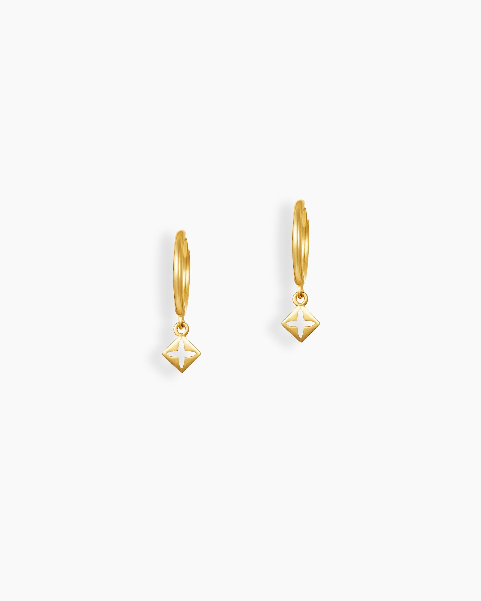 Gold hoop earrings with a geometric drop charm in a subtle star cutout design for a modern look