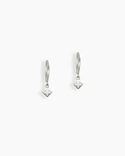 Silver hoop earrings with a geometric drop charm in a subtle star cutout design for a modern look