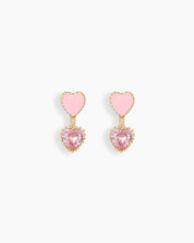 Earrings with a charming duo of hearts—one soft pink enamel and one heart-shaped zircon