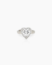 A romantic white ring with a heart-cut zircon stone framed by a border of brilliant pavé crystals