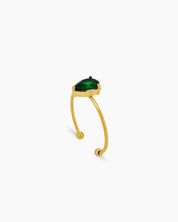 A green ring with an ultra-thin, open gold band and a captivating pear-shaped zircon