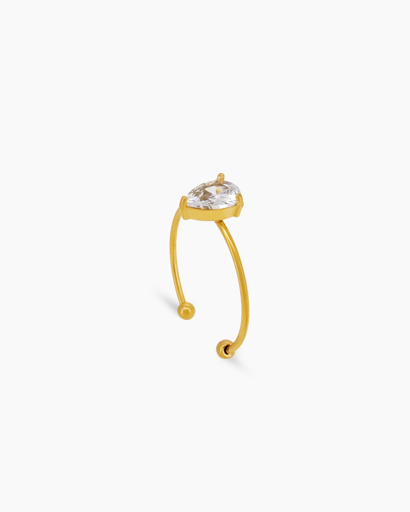 A white ring with an ultra-thin, open gold band and a captivating pear-shaped zircon