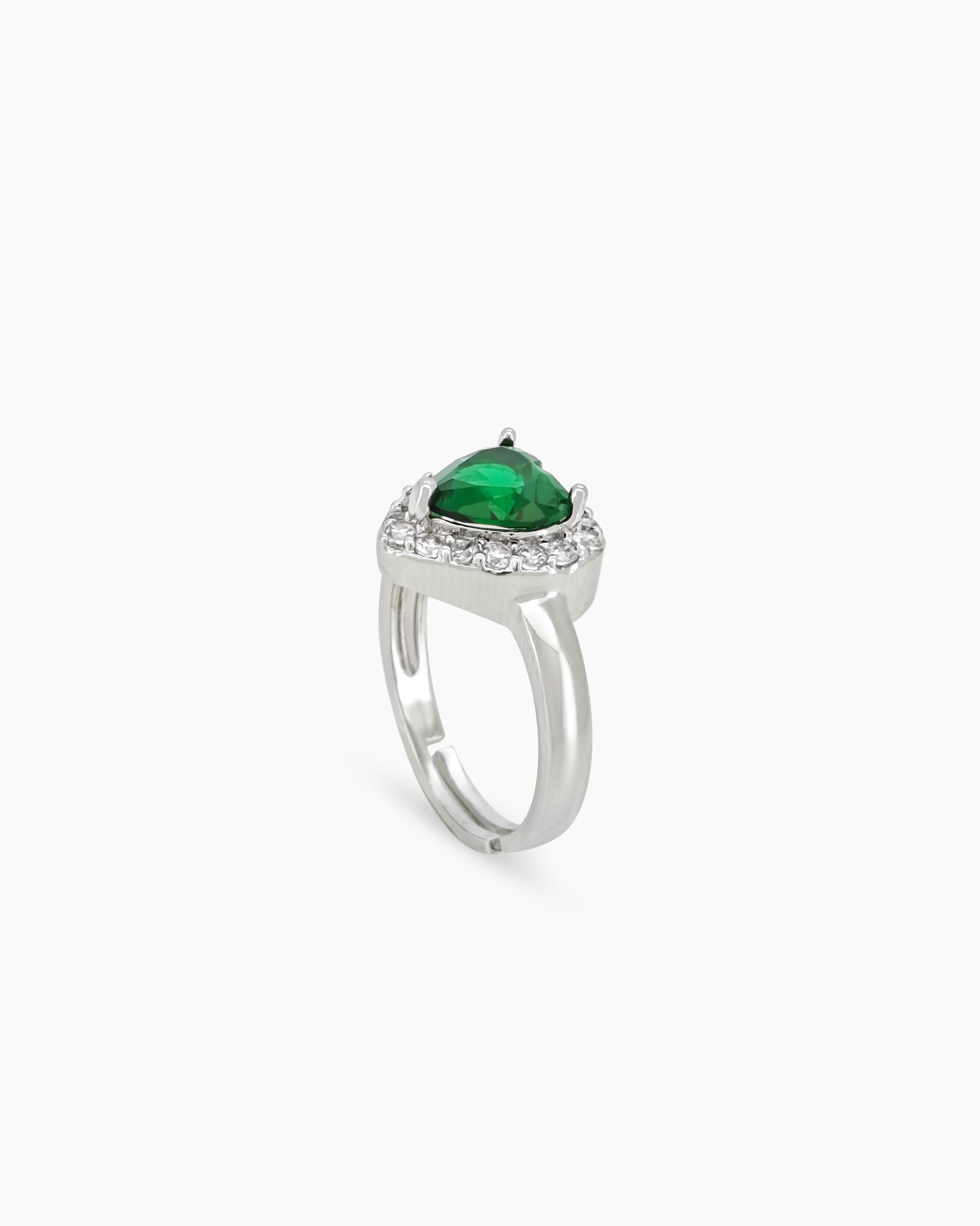 A romantic green ring with a heart-cut zircon stone framed by a border of brilliant pavé crystals