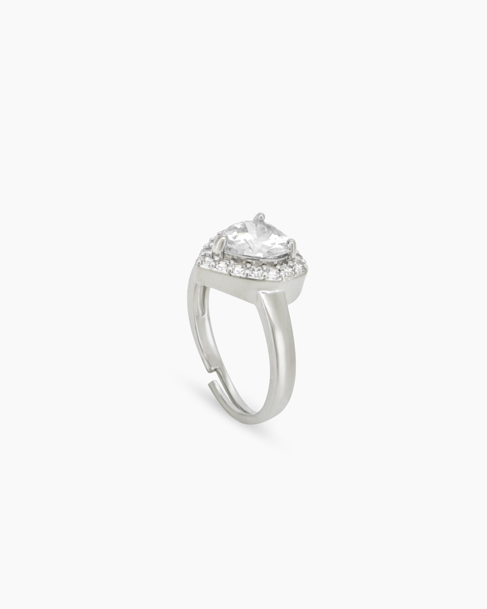 A romantic white ring with a heart-cut zircon stone framed by a border of brilliant pavé crystals