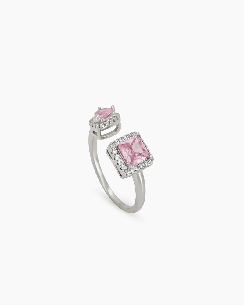 A pink open-front ring with a pavé-framed square-cut zircon and a pear-cut stone for a bold look