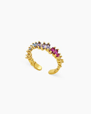An adjustable colored gold-tone band encrusted with a row of baguette-cut zircon stones