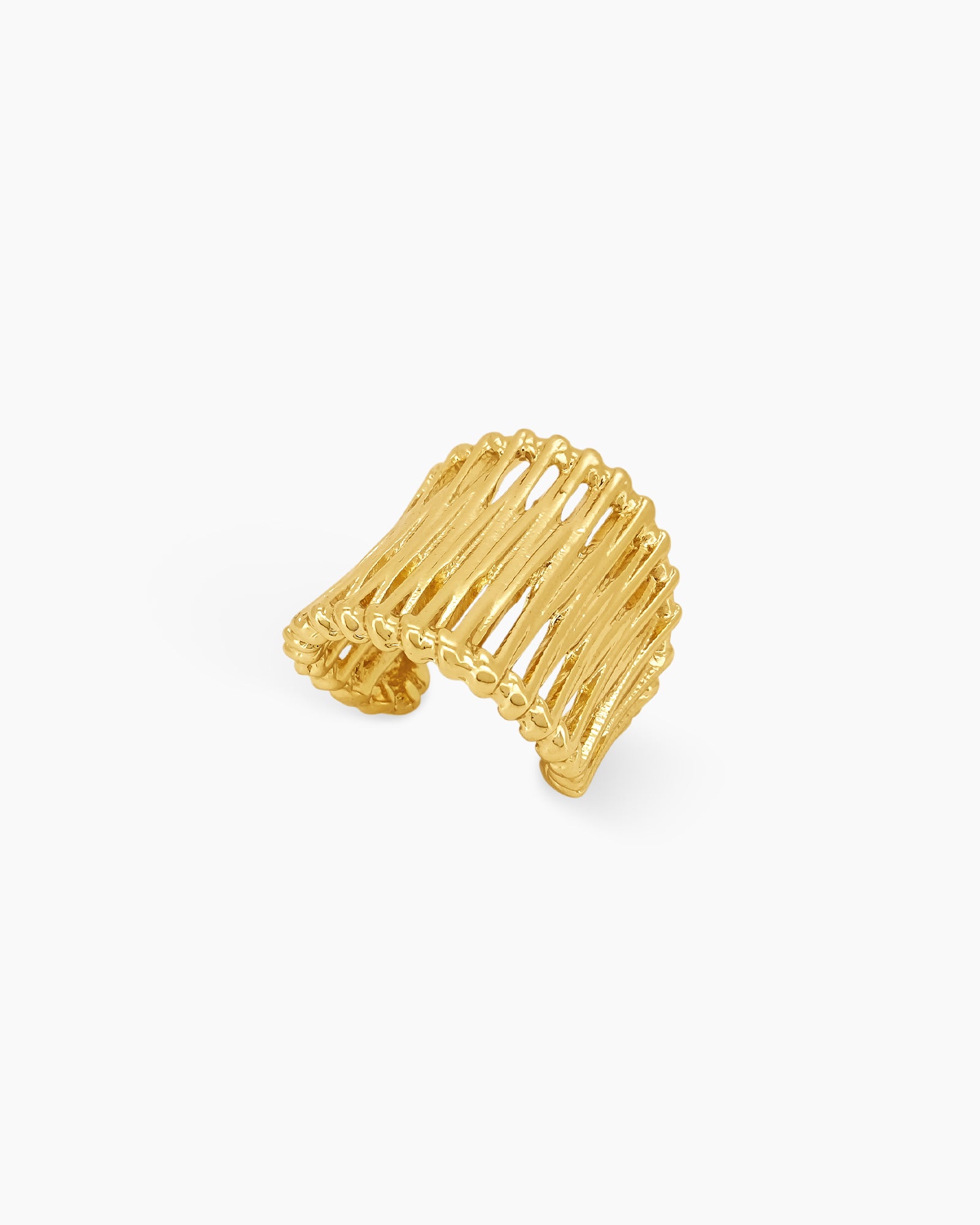 An airy gold statement ring with wavy, openwork bands and an adjustable fit