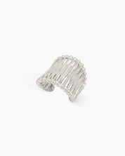 An airy silver statement ring with wavy, openwork bands and an adjustable fit