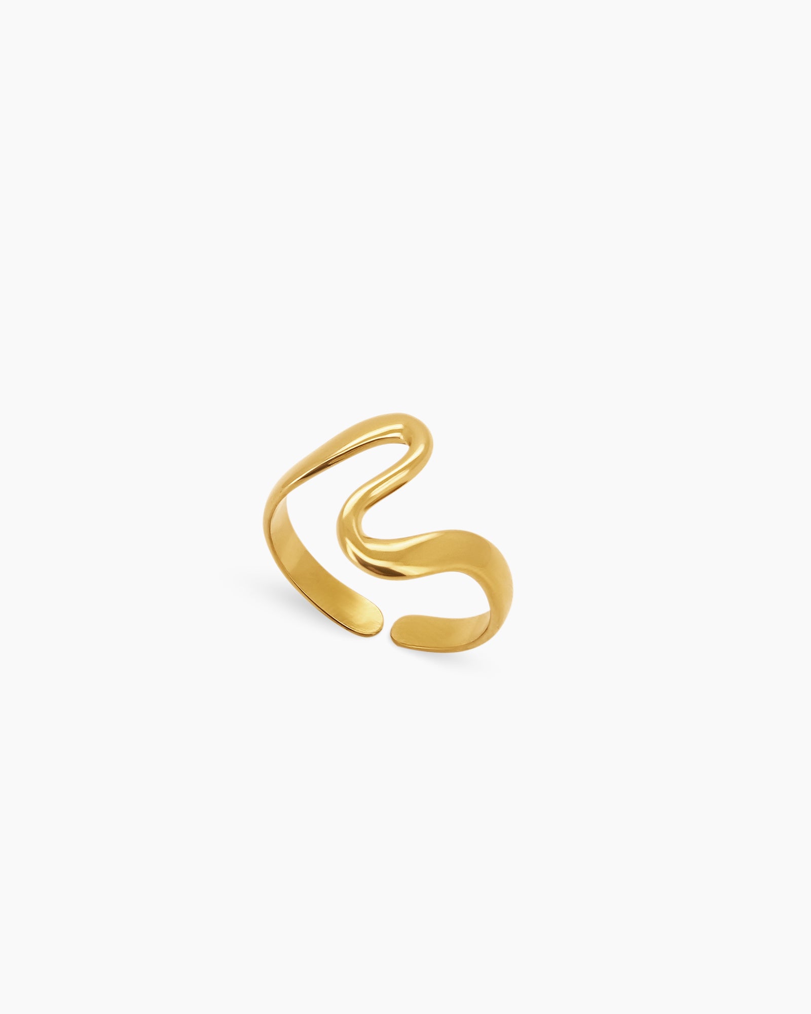 A polished gold-tone ring with a smooth, open silhouette that curves around the finger like a fluid wave