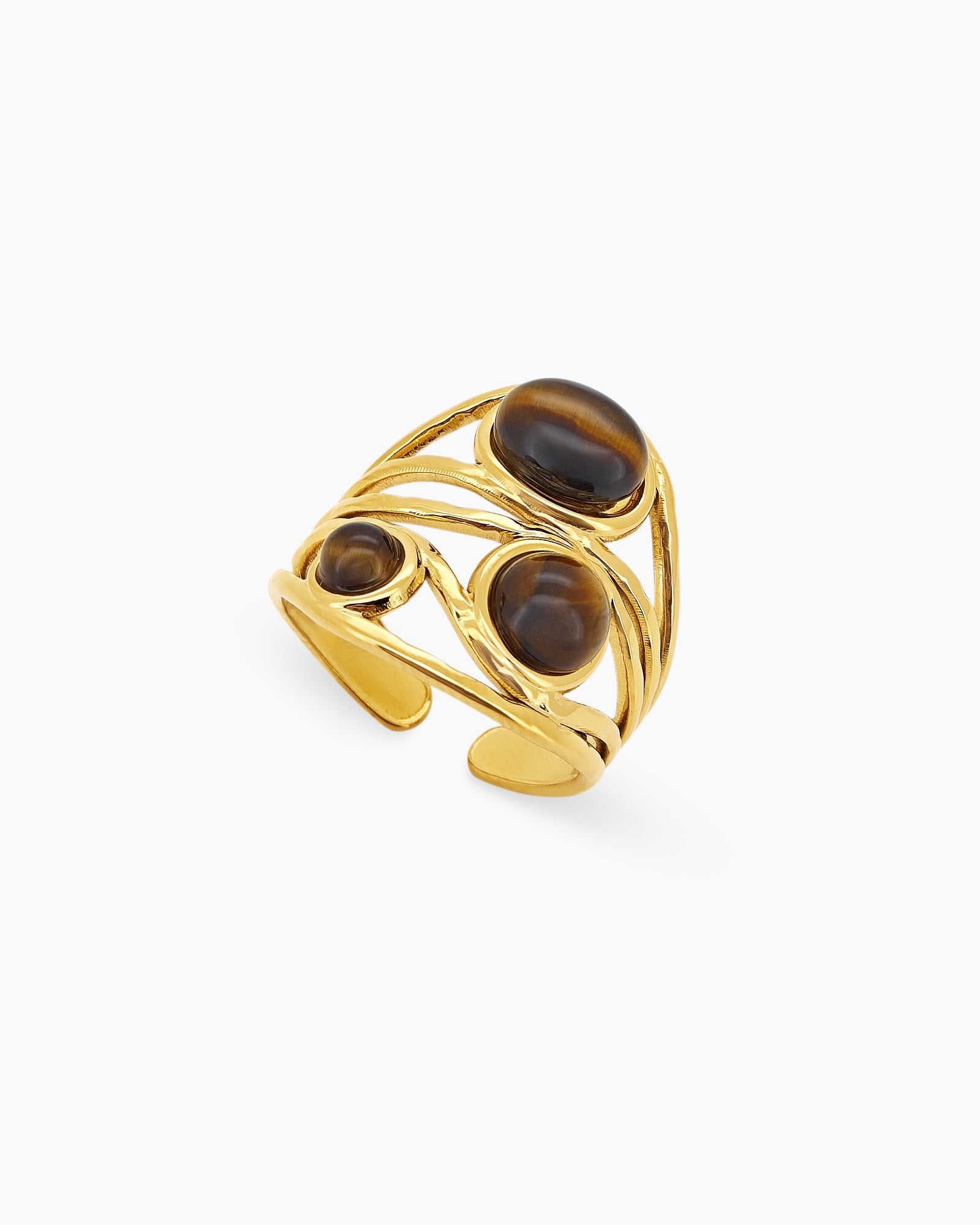 An open-form ring with shimmering natural tiger eye stones on a flowing, vintage-inspired gold band