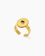 A black adjustable ring with a square-cut zircon at the center of a textured sunburst medallion