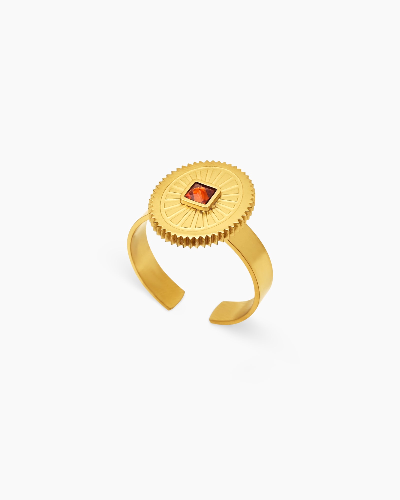 A red adjustable ring with a square-cut zircon at the center of a textured sunburst medallion