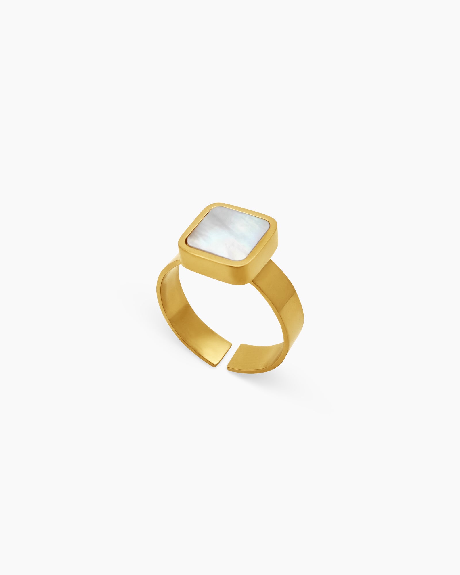 A ring with a square-cut mother-of-pearl inlay, delicately framed in polished gold-tone metal