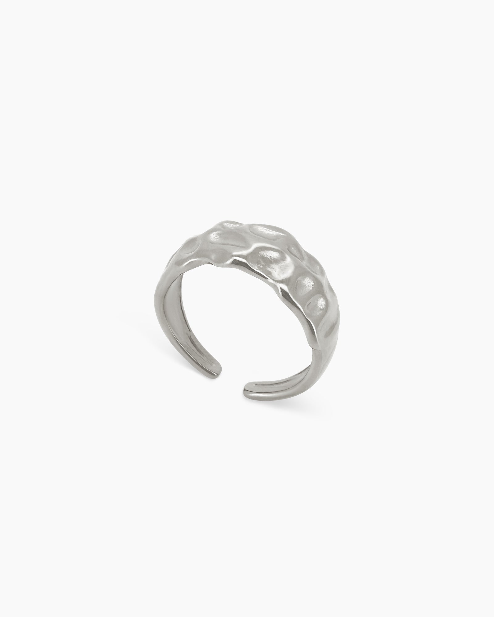 A silver ring with organic ridges, a softly molten texture, and an open band design