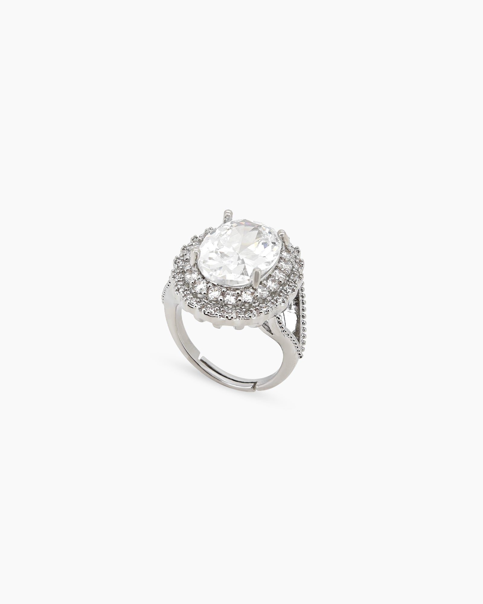 A white ring with a captivating oval-cut zircon stone surrounded by two halos of shimmering crystals
