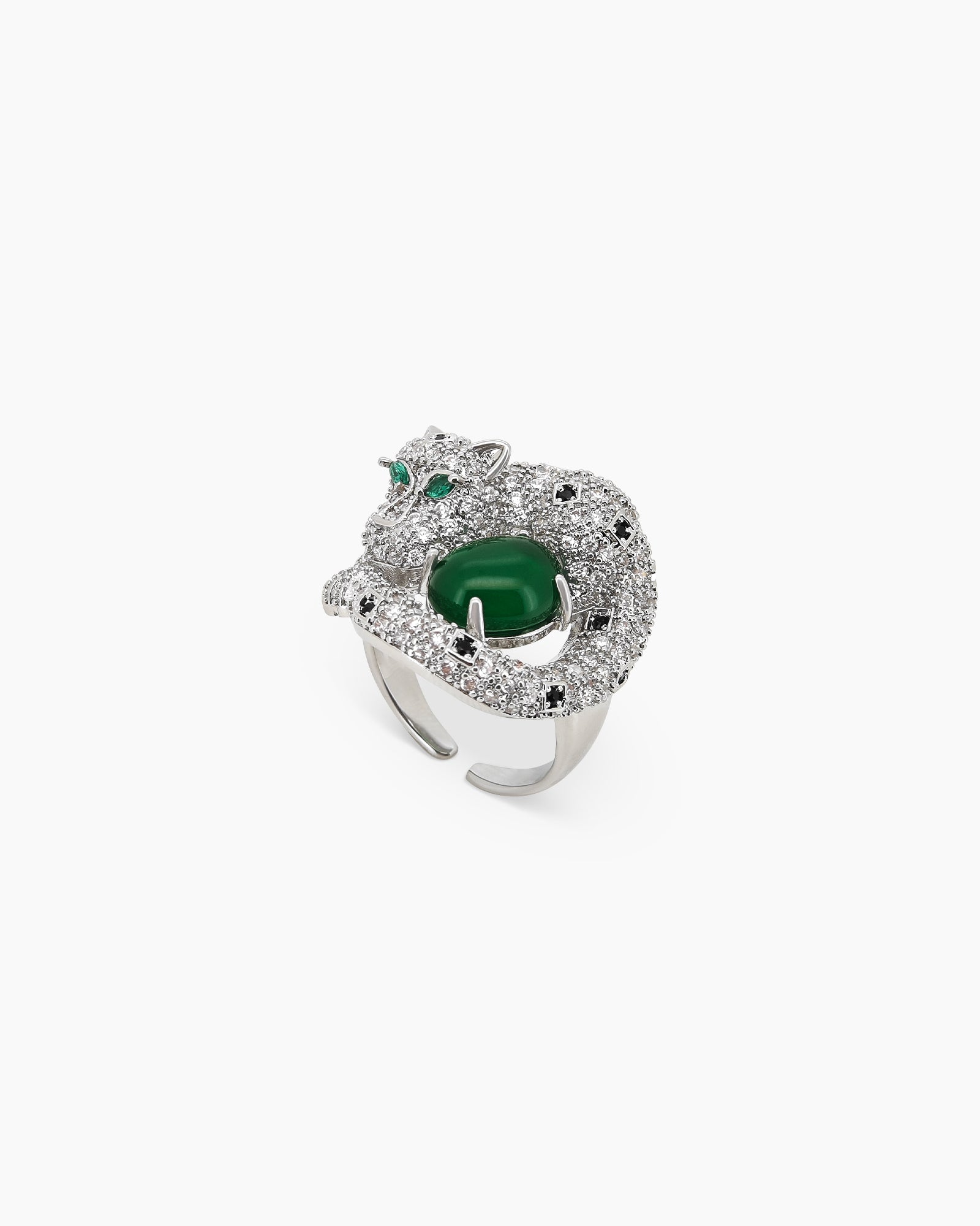 An adjustable silver-tone ring with a zircon-encrusted panther curled around a rich green jade stone