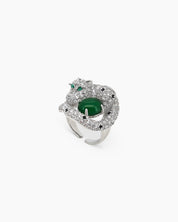 An adjustable silver-tone ring with a zircon-encrusted panther curled around a rich green jade stone
