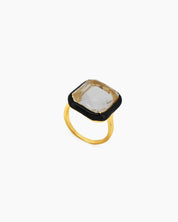 A black-white cocktail ring with an oversized cushion-cut rhinestone encased in vibrant enamel