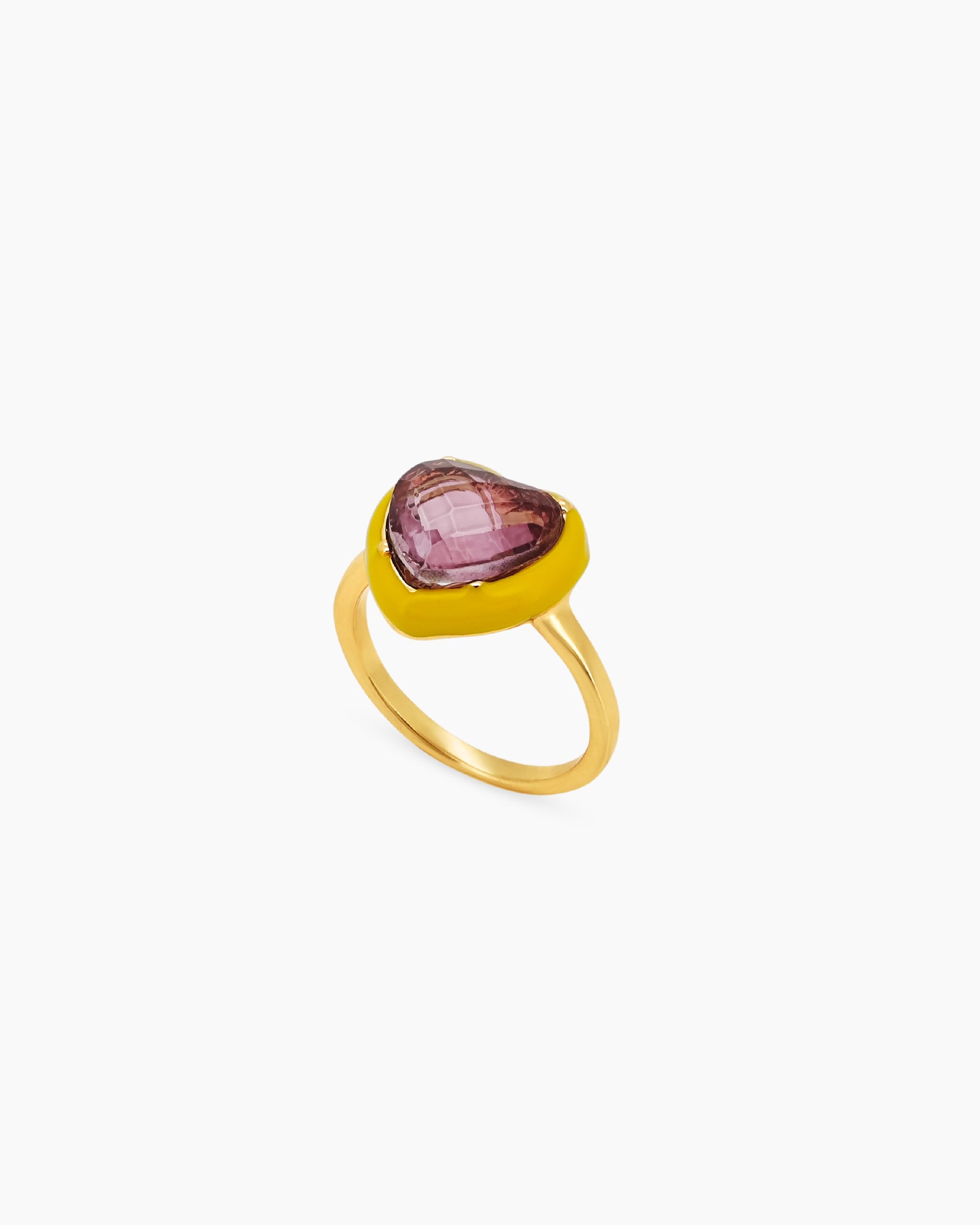 A purple-yellow cocktail ring with an oversized heart-shaped stone cradled by a glossy enamel bezel