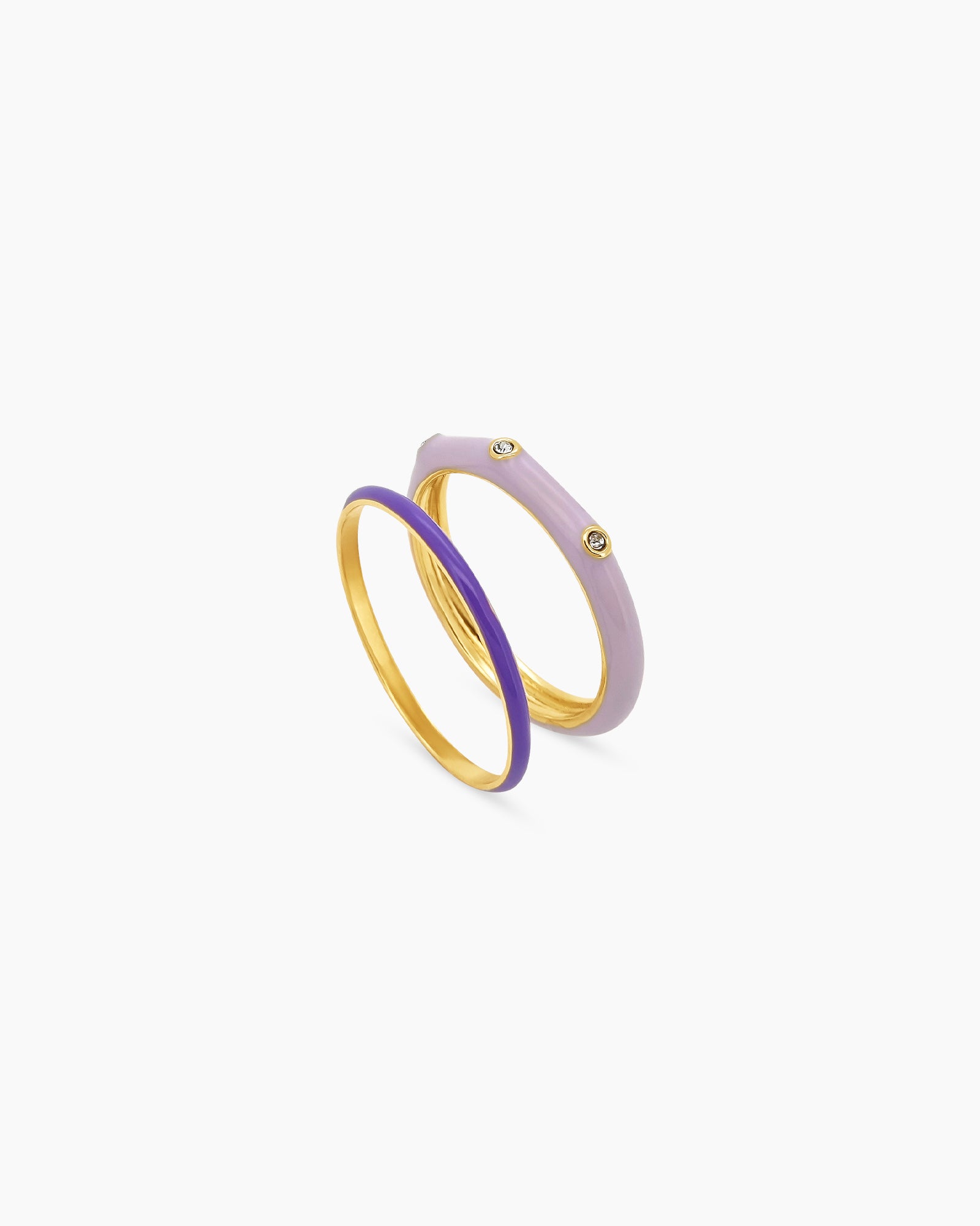 A set of purple stackable rings featuring a mix of sleek enamel finishes, polished bands, and subtle sparkle
