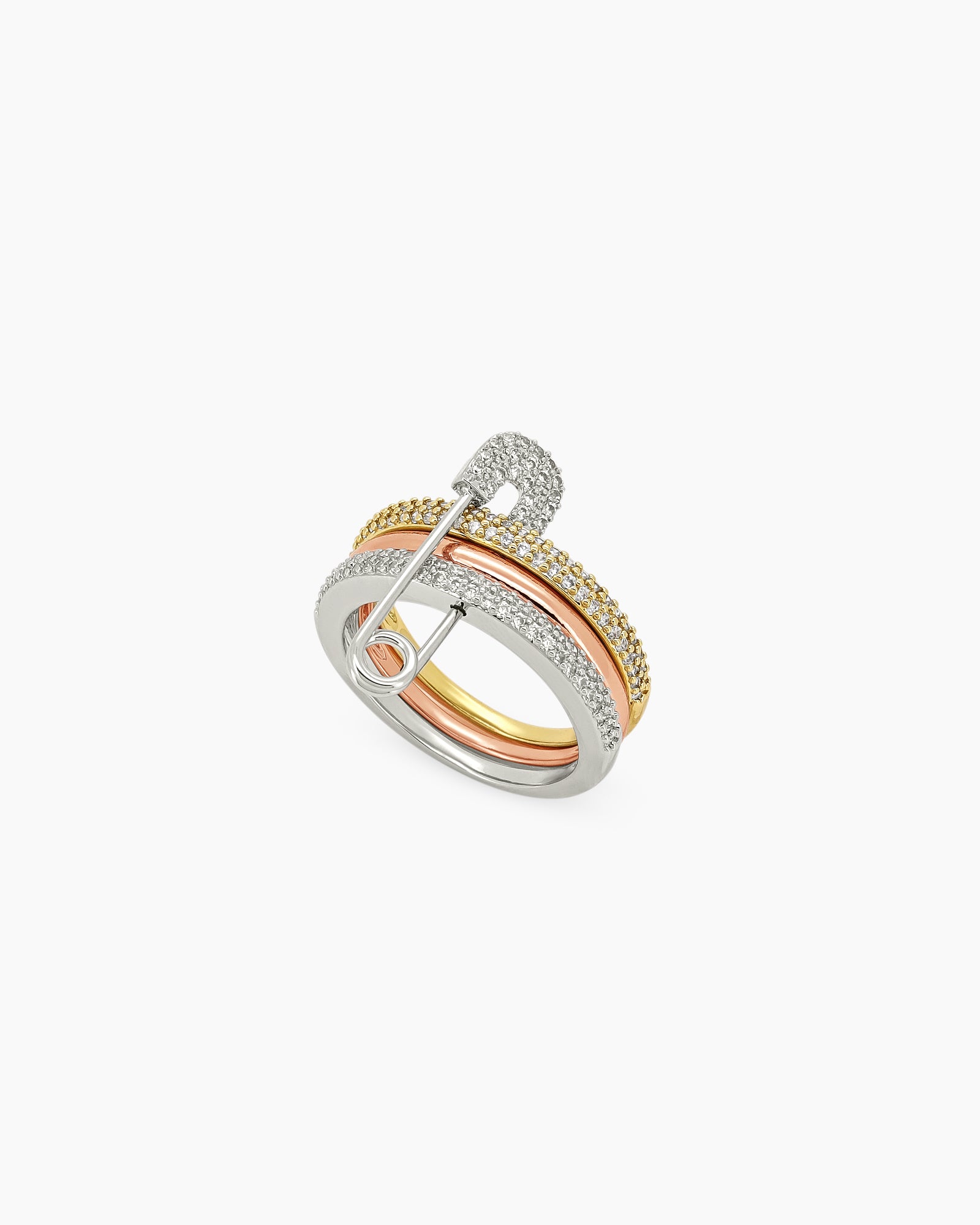 A three-colored stacked band ring with a crystal-studded safety pin detail for a stylish, daring twist