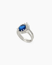 An enchanting duo of stacked rings in silver with a bold navy zircon set in a crown-like frame