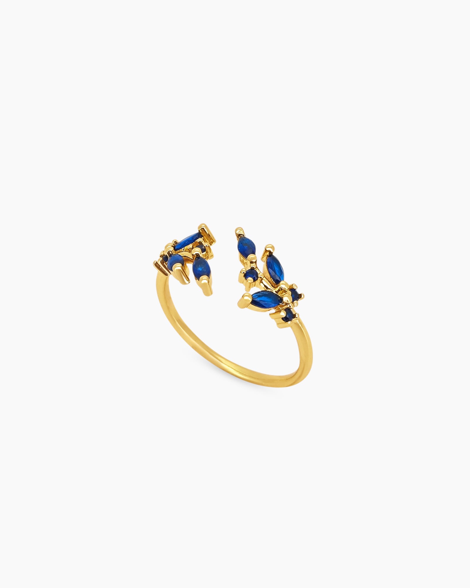 A blue open ring with clusters of marquise-cut zircons that bloom from each side of the band