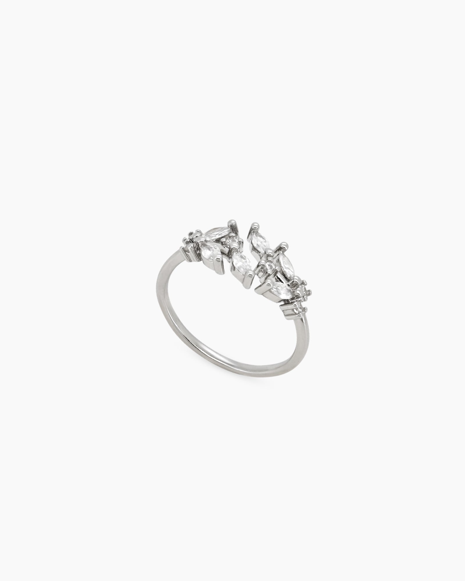 A silver open ring with clusters of marquise-cut zircons that bloom from each side of the band