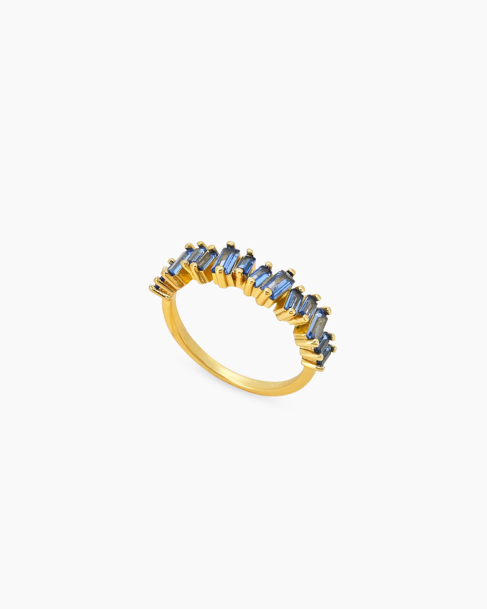 A sleek blue ring with perfectly aligned baguette-cut zircons that sparkle with quiet intensity