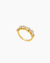A sleek white ring with perfectly aligned baguette-cut zircons that sparkle with quiet intensity