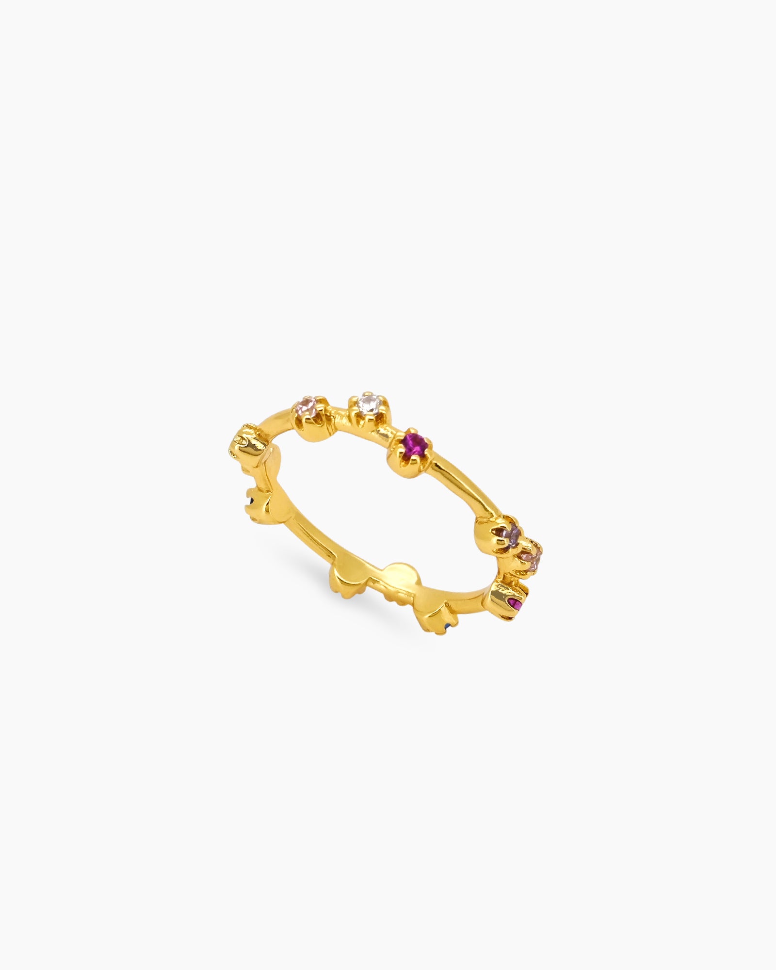 A band ring sprinkled with rainbow-hued zircon stones on a slender gold-plated band with organic curves