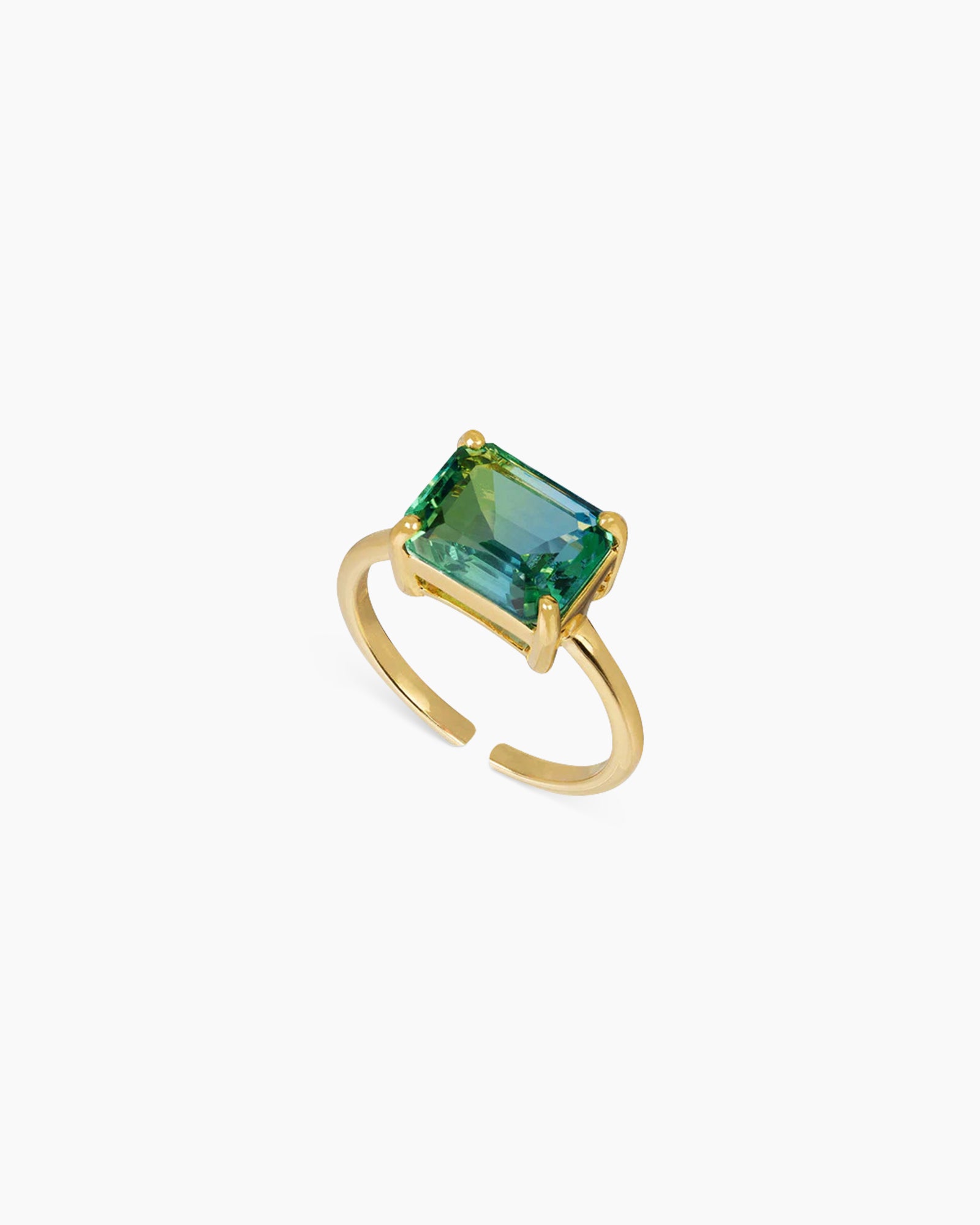 A green-to-blue ring with an emerald-cut ombré zircon that shifts in the light, on a sleek open band