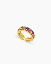 A purple ring, delicately enameled with arched motifs and dotted with bezel-set zircons for an ornate look