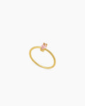 A pink ring with a fine gold-plated band crowned with a marquise-cut zircon for a soft glimmer