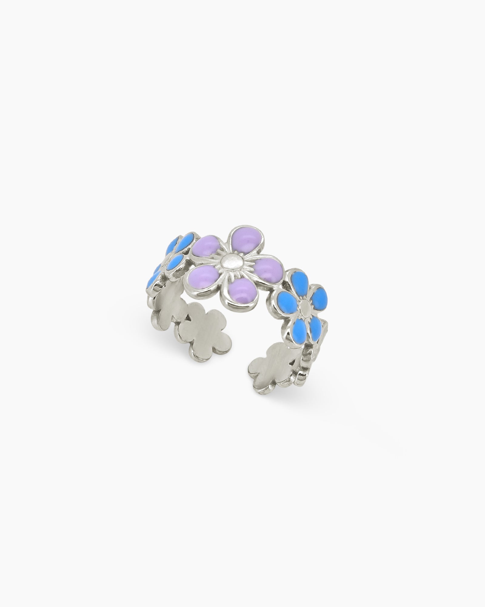An open band ring with a delicate arrangement of enamel flowers in soft lavender, blue, and white