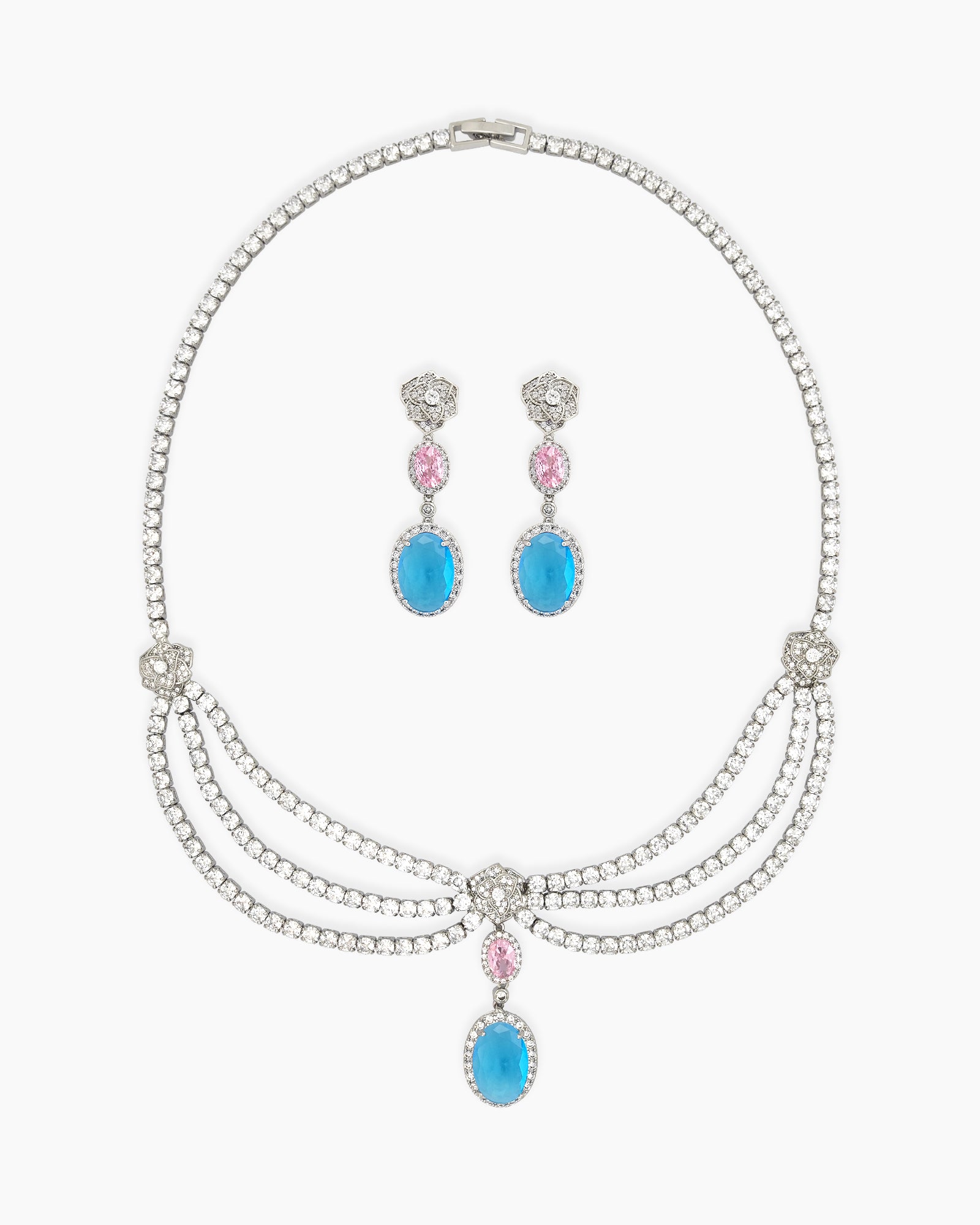 A set with a cascading esclavage-style necklace and matching earrings in soft pink and ocean-blue drops