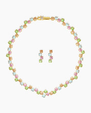 A set with a collar-style necklace and drop earrings, adorned with a playful array of pastel zircon stones