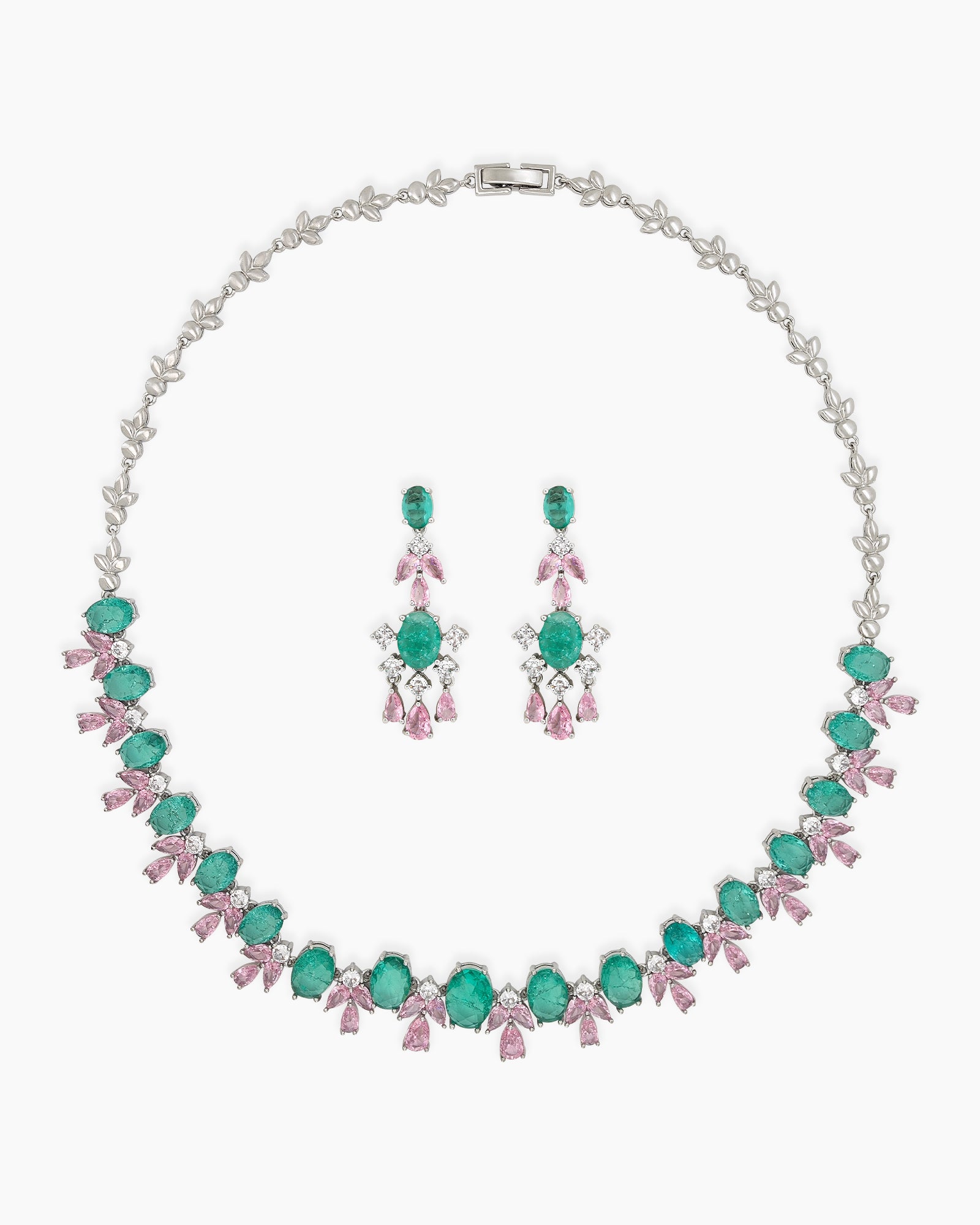 A jewelry set with radiant green oval zircons flanked by whimsical pink and white gemstone accents