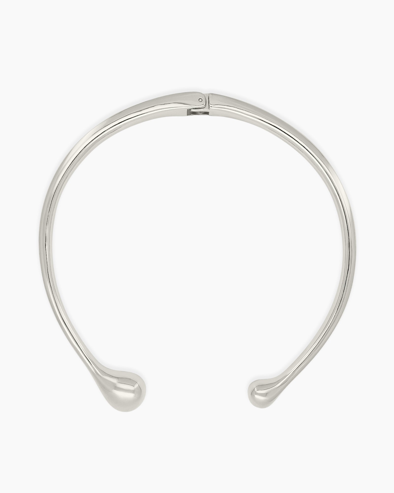 A polished silver necklace featuring a clean, wide torque design with smooth, droplet-like tips