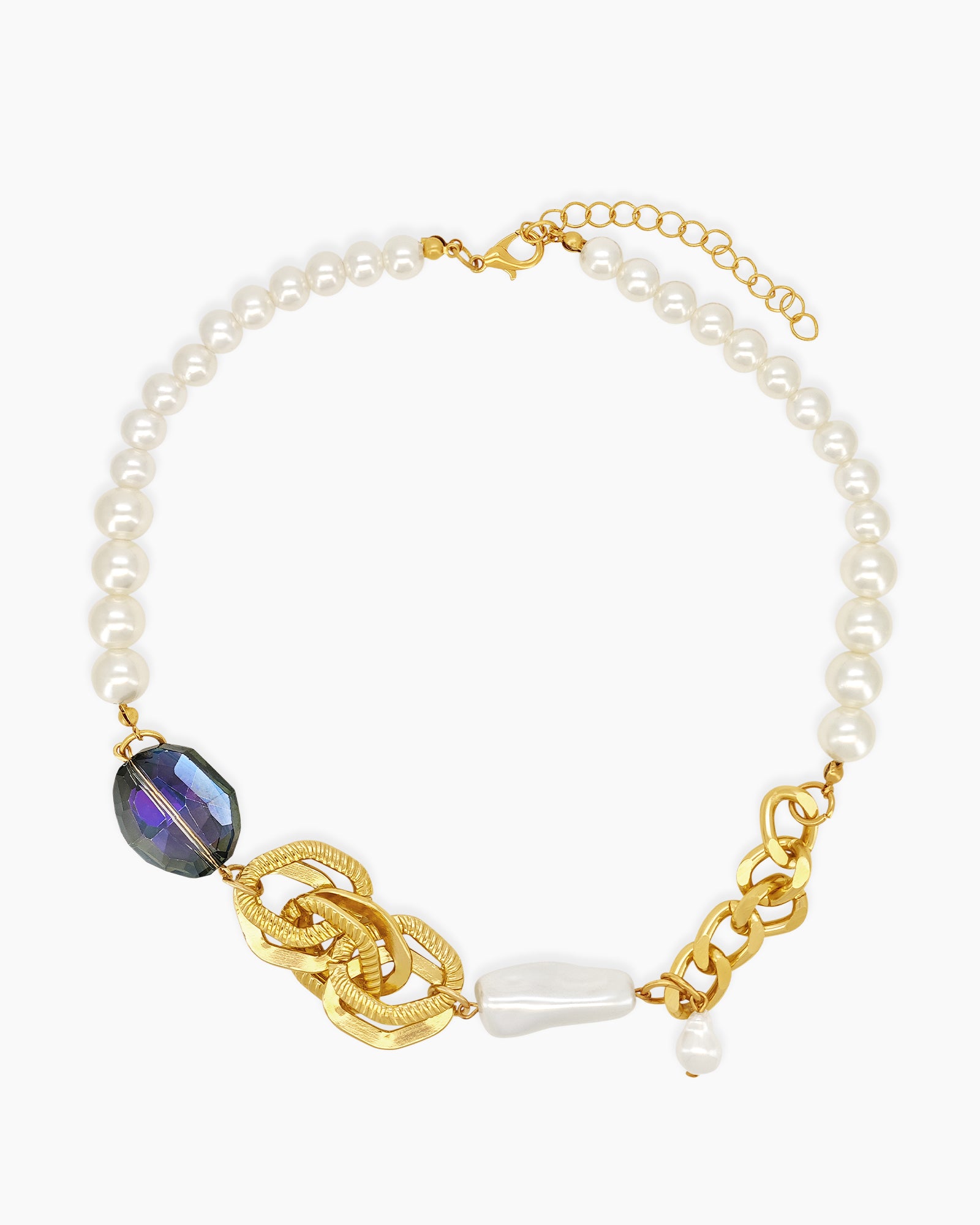 A necklace with a curated blend of glossy faux pearls, chunky gold links, and iridescent beads