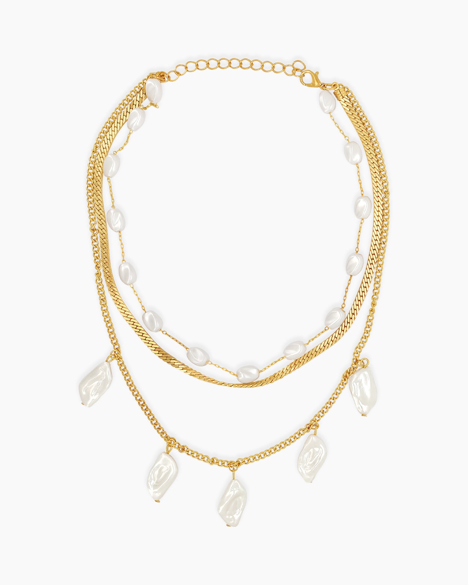 A layered necklace of luminous pearls and golden chains, with irregular baroque-style faux pearls