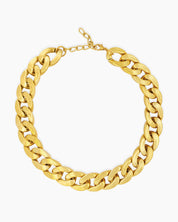 A gold necklace with a chunky silhouette and sleek polish that is both timeless and modern