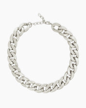 A silver necklace with a chunky silhouette and sleek polish that is both timeless and modern
