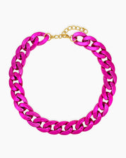 A magenta necklace of oversized curb links with a high-gloss metallic finish for an expressive look