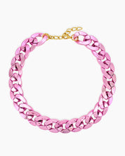 A pink necklace of oversized curb links with a high-gloss metallic finish for an expressive look