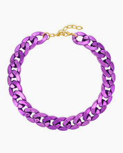 A purple necklace of oversized curb links with a high-gloss metallic finish for an expressive look