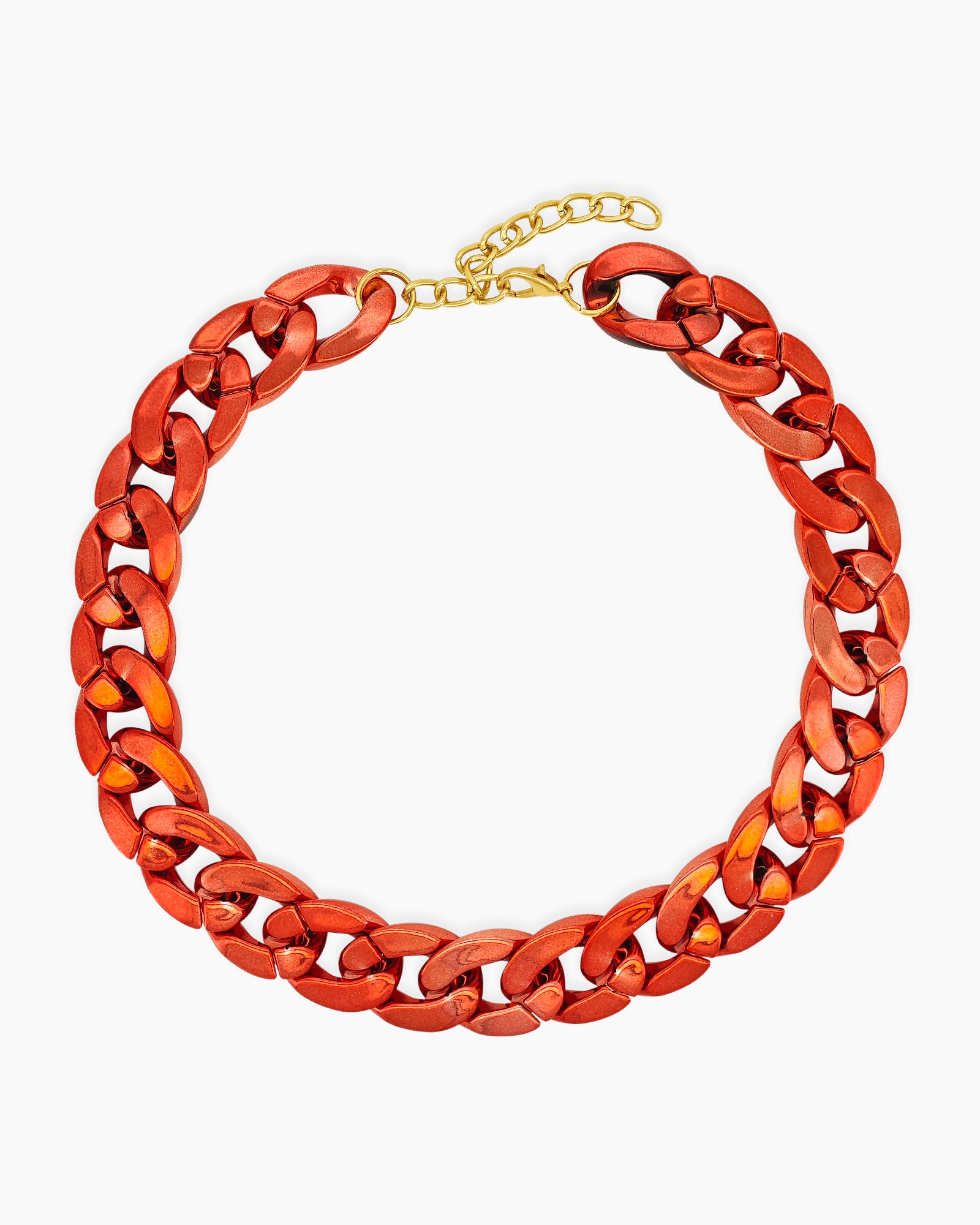 A red necklace of oversized curb links with a high-gloss metallic finish for an expressive look