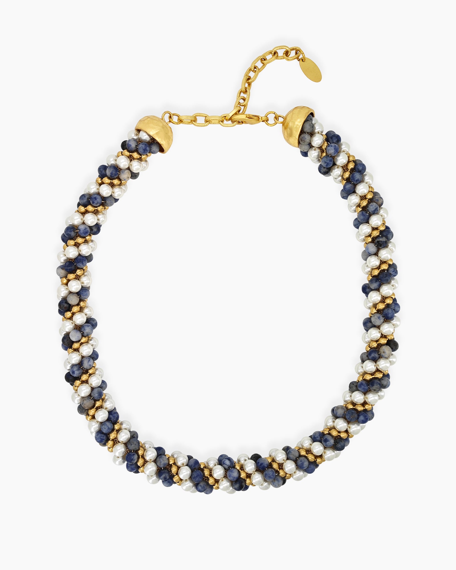 A swirling necklace of creamy pearls, twilight-hued beads, and golden accents twisted in a harmonious spiral